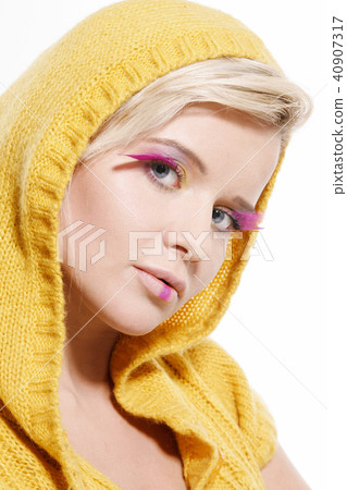 Portrait of Young Woman Wearing Pink Feathers 40907317