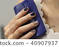 Beautiful female hand with manicure  40907937