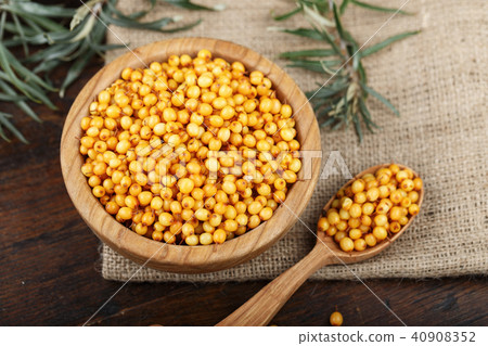 sea-buckthorn in a wooden plate 40908352