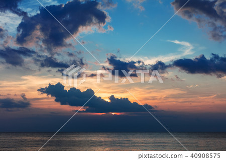 colorful cloudy sunset over ocean colorful cloudy sunset over ocean 40908575