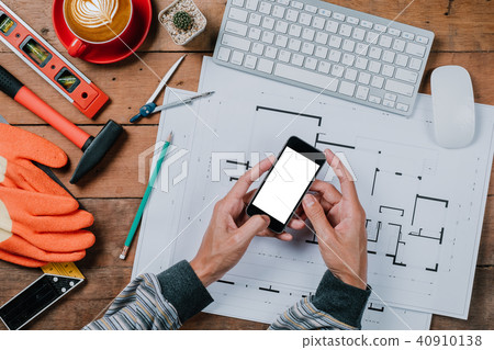 Engineer man using smart phone with blank screen Engineer man using smart phone with blank screen 40910138