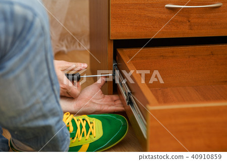 Photo of man picking furniture 40910859