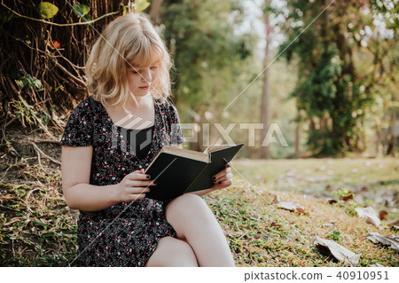 Happy teenager  reading book 40910951