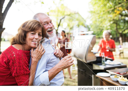 Family celebration or a barbecue party outside in the backyard. Family celebration or a barbecue party outside in the backyard. 40911870