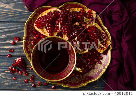 cup with red juice on the table 40912015
