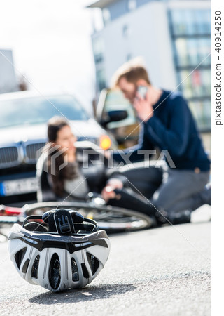 Close-up of a bicycling helmet fallen down on the ground after an accident Close-up of a bicycling helmet fallen down on the ground after an accident 40914250