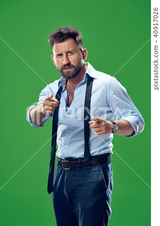 The overbearing businessman point you and want you, half length closeup portrait on green background The overbearing businessman point you and want you, half length closeup portrait on green background 40917026