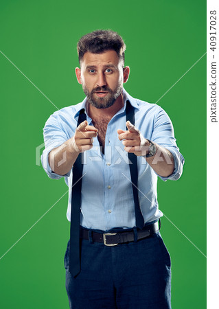 The overbearing businessman point you and want you, half length closeup portrait on green background 40917028