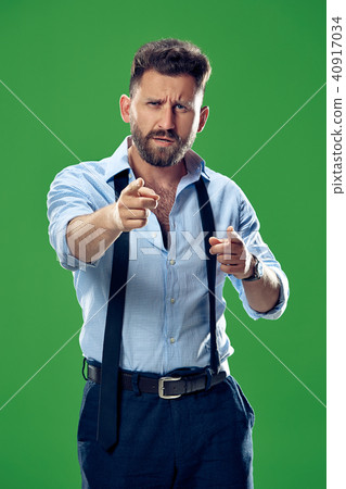 The overbearing businessman point you and want you, half length closeup portrait on green background The overbearing businessman point you and want you, half length closeup portrait on green background 40917034