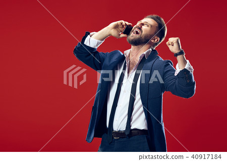 Handsome businessman with mobile phone Handsome businessman with mobile phone 40917184