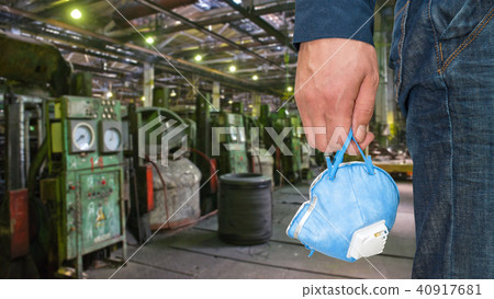 Worker with protective respirator 40917681