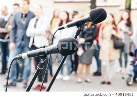 Two microphones stand on the street 40918491