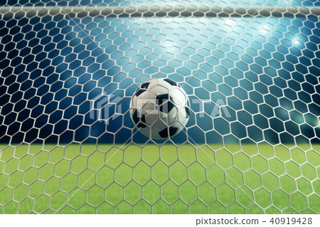3d rendering soccer ball in goal. Soccer ball in net with spotlight and stadium light background 40919428