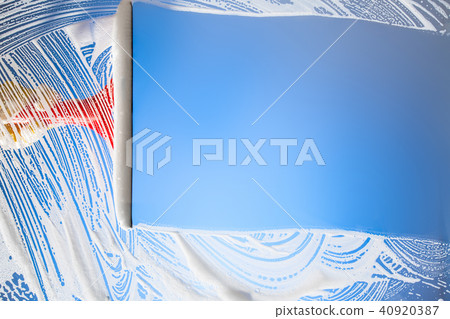 cleaning window with squeegee blue sky cleaning window with squeegee blue sky 40920387