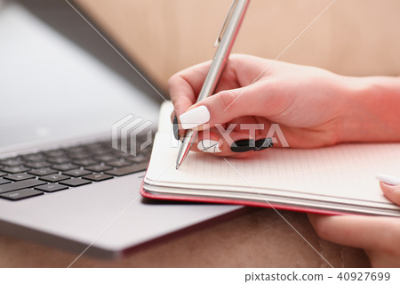 woman study hard write down information to notebook woman study hard write down information to notebook 40927699
