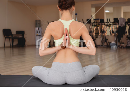Young woman practicing yoga  40930038