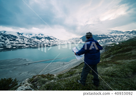 One person looking at trekking map. 40933092