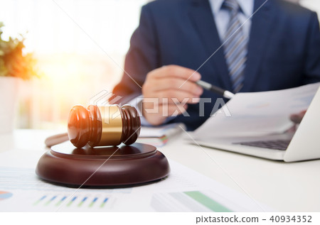 Justice symbol wooden gavel on table. 40934352