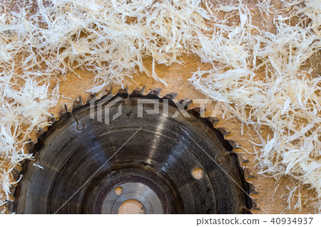 Carpenter tools on wooden table with sawdust. Circular Saw. Cutting a wooden plank 40934937