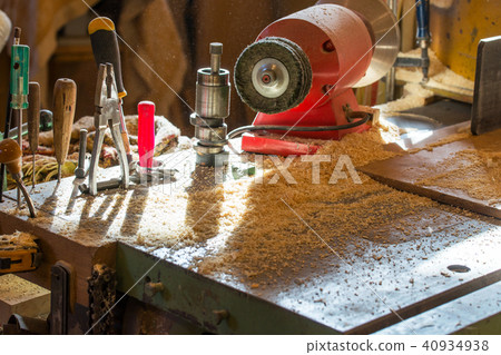 Carpenter tools on wooden table with sawdust 40934938