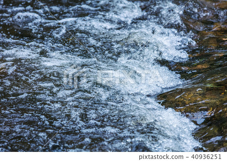 Water running over rocks Water running over rocks 40936251