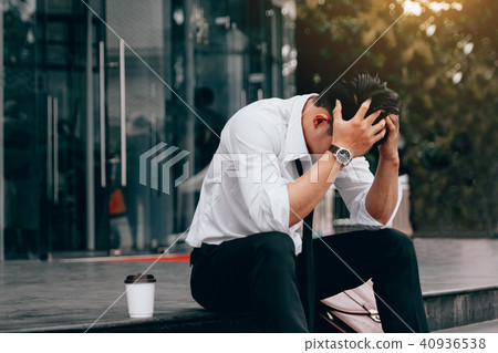 Asian young businessman stress sitting in front Asian young businessman stress sitting in front 40936538