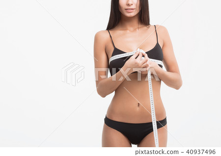 Young beautiful girl measures your body parts of roulette 40937496