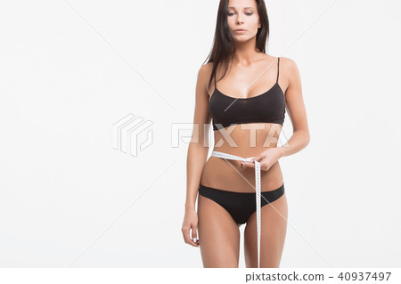 Young beautiful girl measures your body parts of roulette 40937497