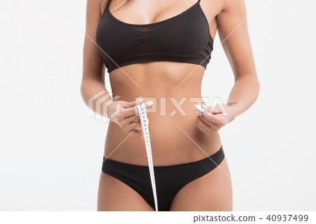 Young beautiful girl measures your body parts of roulette 40937499