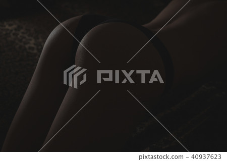 Back and butt naked women.on a black background Back and butt naked women.on a black background 40937623