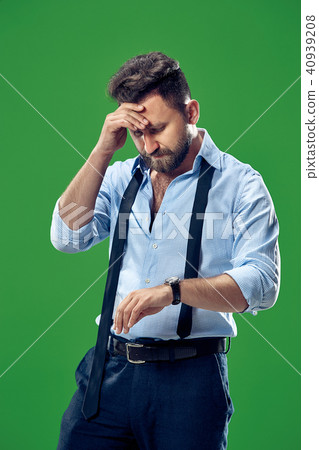 Handsome businessman checking his wrist-watch Isolated on white background Handsome businessman checking his wrist-watch Isolated on white background 40939208