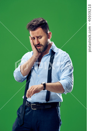 Handsome businessman checking his wrist-watch Isolated on white background Handsome businessman checking his wrist-watch Isolated on white background 40939218