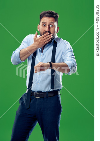 Handsome businessman checking his wrist-watch Isolated on white background 40939235