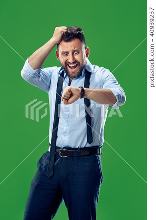 Handsome businessman checking his wrist-watch Isolated on white background 40939237