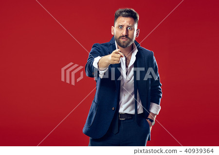 The overbearing businessman point you and want you, half length closeup portrait on red background. The overbearing businessman point you and want you, half length closeup portrait on red background. 40939364