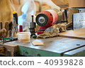 Carpenter tools on wooden table with sawdust 40939828