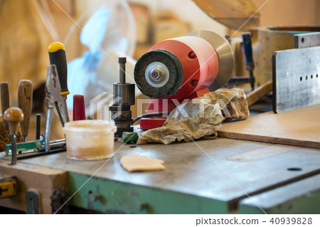 Carpenter tools on wooden table with sawdust 40939828