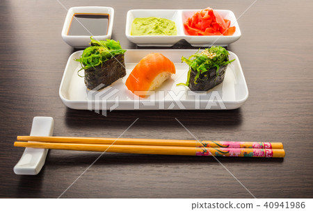 sushi with salmon and spicy gunkan sushi with salmon and spicy gunkan 40941986