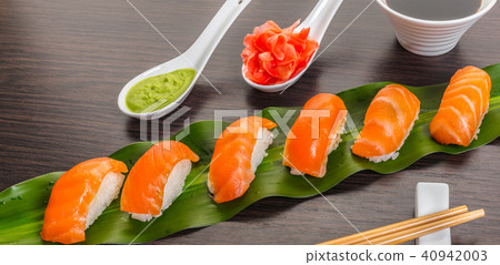 sushi with salmon on a leaf sushi with salmon on a leaf 40942003