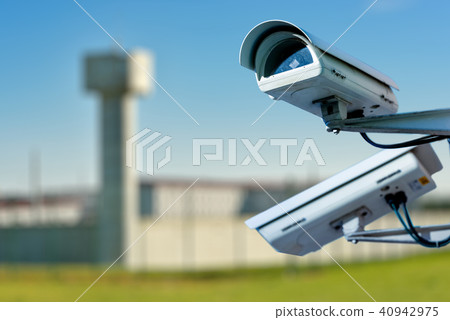 security CCTV camera with prison on background security CCTV camera with prison on background 40942975