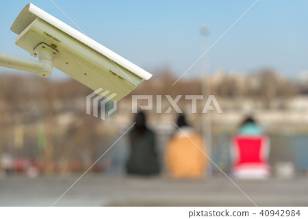security CCTV camera with tourists on background security CCTV camera with tourists on background 40942984