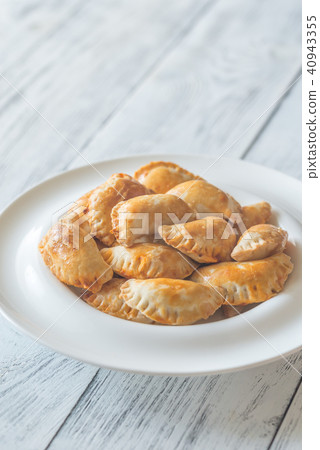 Mini chicken pies on the white plate Mini chicken pies on the white plate 40943355