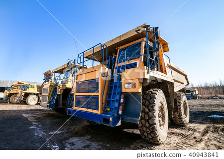 Yellow dump trucks 40943841