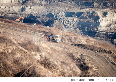 Dump truck moving by the road to coal mine 40943845