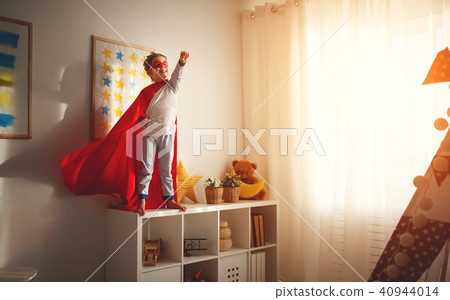 child girl in a super hero costume child girl in a super hero costume 40944014