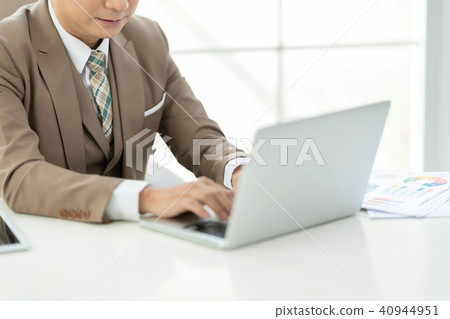 Experienced businessman sitting work on laptop. 40944951