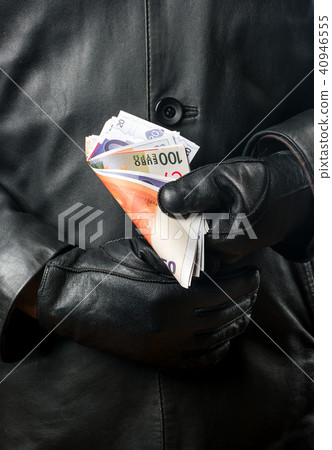 Bandit with money in hands 40946555