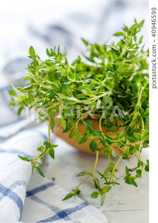 Fresh thyme in a wooden bowl. Fresh thyme in a wooden bowl. 40946598