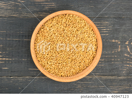 Grains of fenugreek in bowl Grains of fenugreek in bowl 40947123