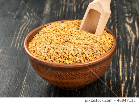 Grains of fenugreek in bowl Grains of fenugreek in bowl 40947133